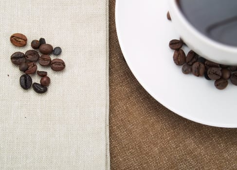 Coffee beans and a coffee cup