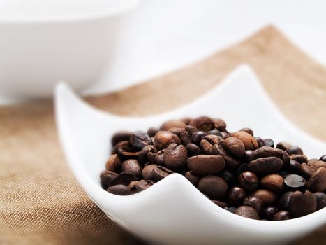 Coffee beans in a white bowl