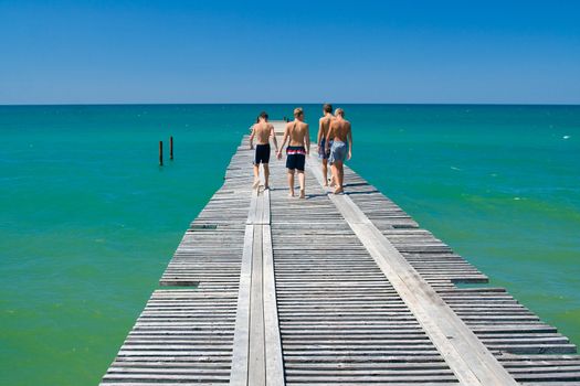 Kids on the old wooden pier