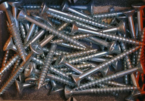 Close up of screws in a workman's toolbox