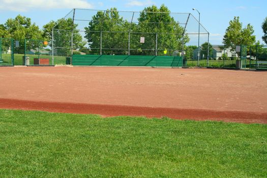 Empty baseball field on a sunny day.
