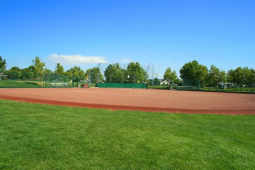 Empty baseball field on a sunny day.
