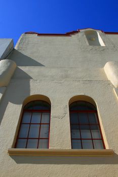 Close up of the windows of a building.
