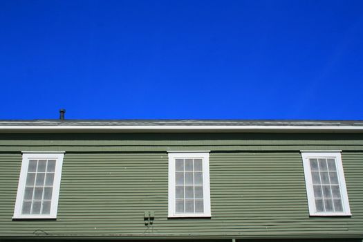 Close up of the windows of a building.
