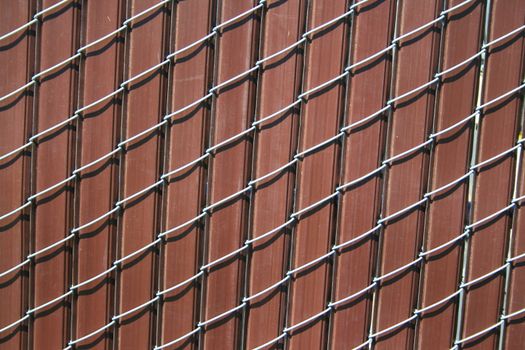 Close up of a chain link fence showing unique pattern.