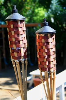 Close up of the two garden torches.
