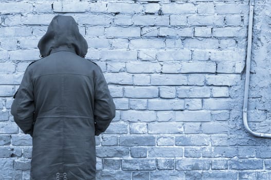 man against wall