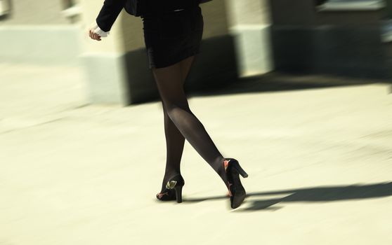 slim girl going on the street