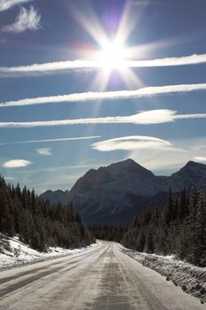 Canadian Mountain under blue sky with lenticular cloud