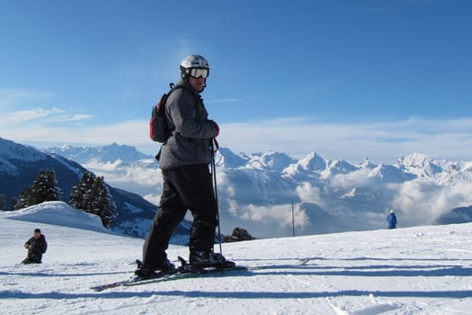 Skier in front of the Alps