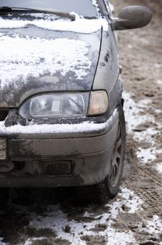 automobile with dirty frozen ice(focus point on the light)