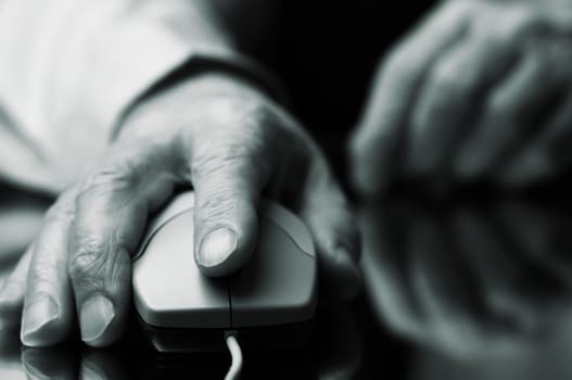 hand of the man with computer mouse,focus point on the finger,special tone photo f/x