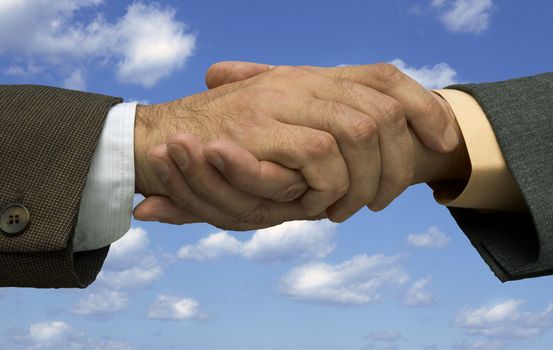 handshaking on the sky background ,made form my images