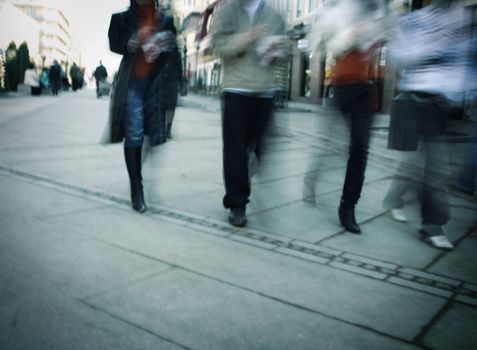 people walking, special blur zoom motion and toned wit dark vignetting photo f/x