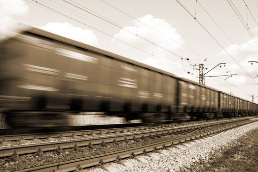 special toned and blur-motion photo f/x, focus point on railroad embankment and rail