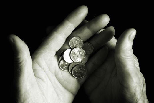 old hand with coins, selective focus