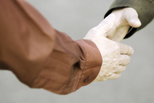 hands of businessmen, focus point on nearest