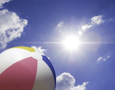 beach ball on sky background, focus point on toy ,special photo f/x