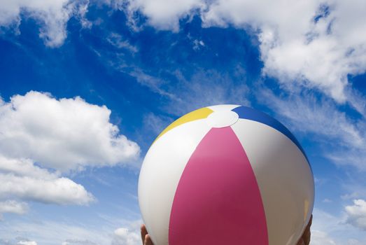 summer concept on sky background, focus point on the ball