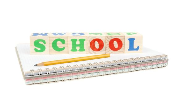 isolated notebook, pen and bricks on white background
