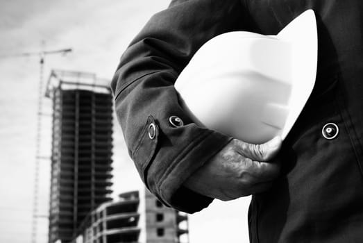 focus point on the hard-hat and hand, special black and white photo toned f/x