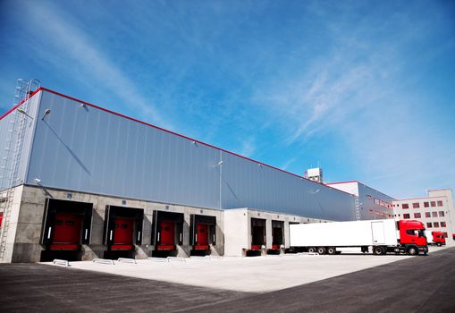 truck in front of an industrial logistics building