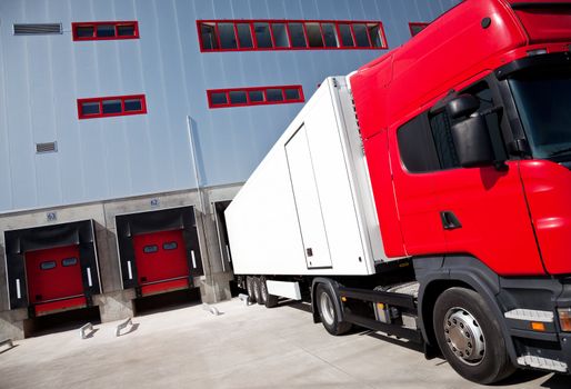 truck in front of an industrial logistics building