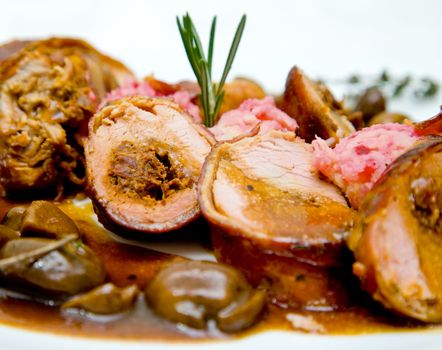 Close-up of pork fillet dish with sauce mushrooms