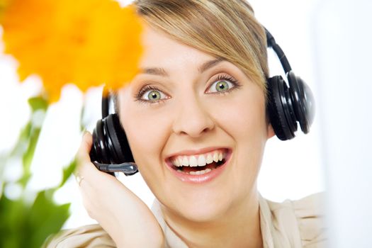 Portrait of beautiful smiling excited call center woman with headset