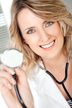 Close-up of beautiful smiling female doctor with stethoscope