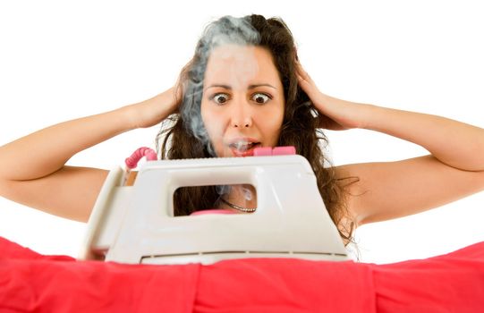 Close-up of female in panic holding her head over burning iron