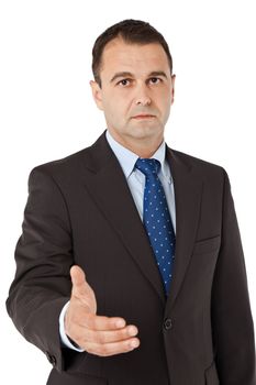 Portrait of serious businessman with suit offering handshake, isolated
