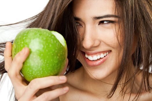 Close-up of a beautiful smiling female holding granny smith apple