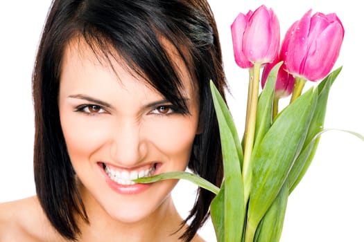 Portrait of female face biting tulip leaf, looking at camera