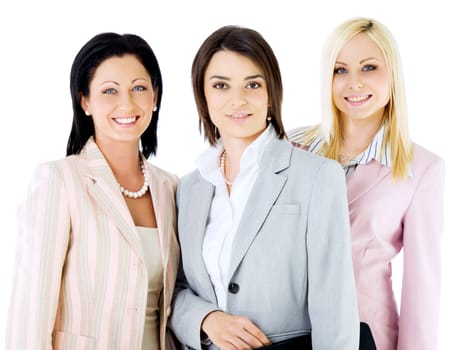 Team of three successful businesswomen looking at camera, smiling