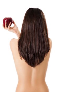 Topless female back to camera holding red apple in hand, isolated on white