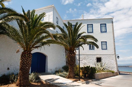 Traditional greek island house with palm-trees in Spetses, Greece