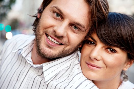 close-up of a young positive couple outdoors