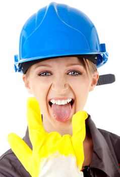 Portrait of young female construction worker with blue hardhat and yellow glove, showing rock on sign