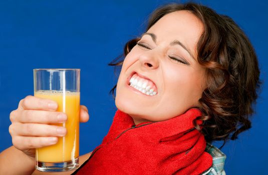 woman in pain, holding glass of orange juice, being strangled by the throat