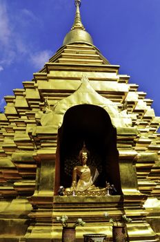 A golden wat with buddha in Chiang Mai, Thailand