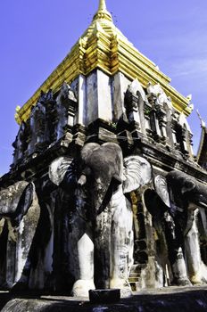 An old temple in Chiang Mai, Thailand with statues of Elephants