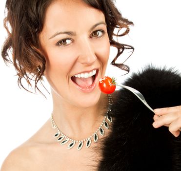 Beautiful elegant woman cherry tomato, looking at camera