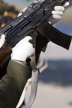 Victory Day in Russia (editorial photo, focus point on hands and weapon selective)