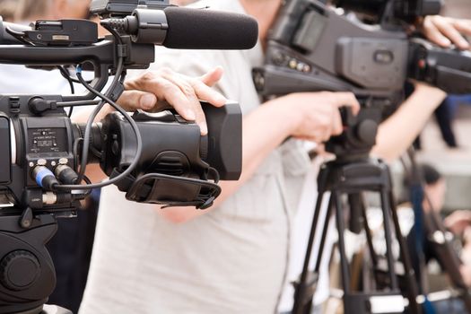 news cameraman,  selective focus point on nearest