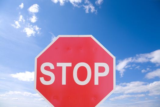 road sign on blue sky background