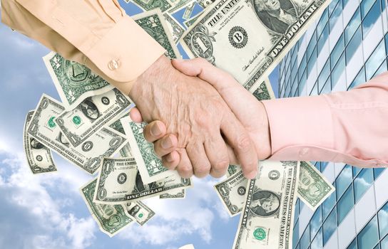 a lot of dollars(like a wind) outside office building and business handshake