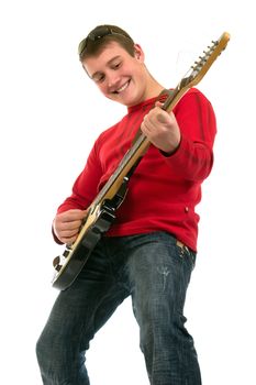 The young man is keen playing on an electroguitar