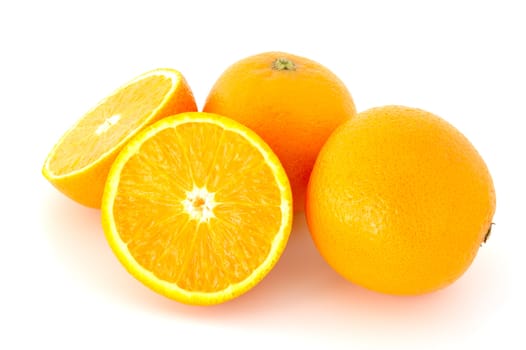 Few juicy oranges on verwhite (not isolated) background.