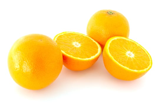 Few juicy oranges on verwhite (not isolated) background.